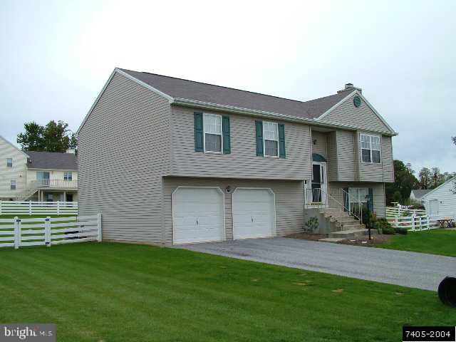 235 Pond Road Felton, PA 17322 - Photo 2 of 2 a front view of a house with a garden