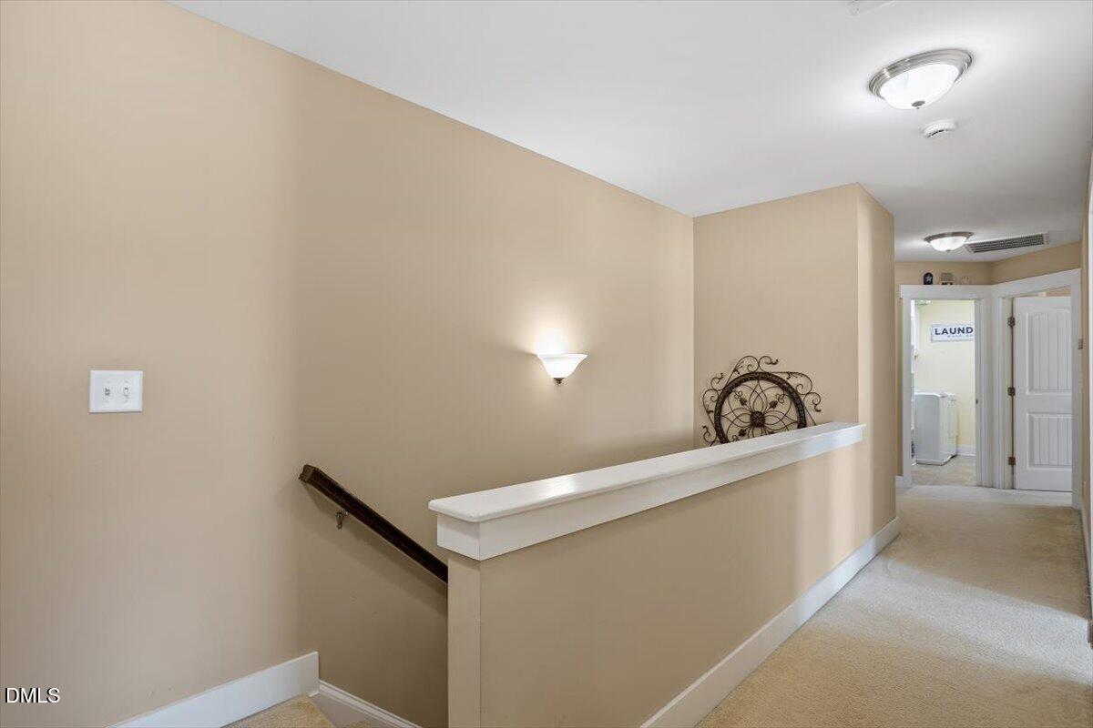 4222 Vineyard Ridge Drive Zebulon, NC 27597 - Photo 13 of 39 a view of a hallway with a sink