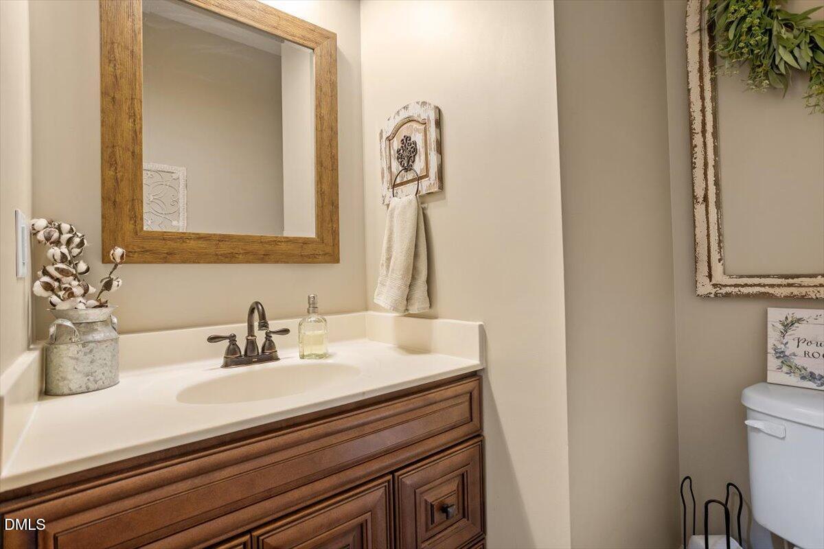 4222 Vineyard Ridge Drive Zebulon, NC 27597 - Photo 20 of 39 a bathroom with a sink and a mirror