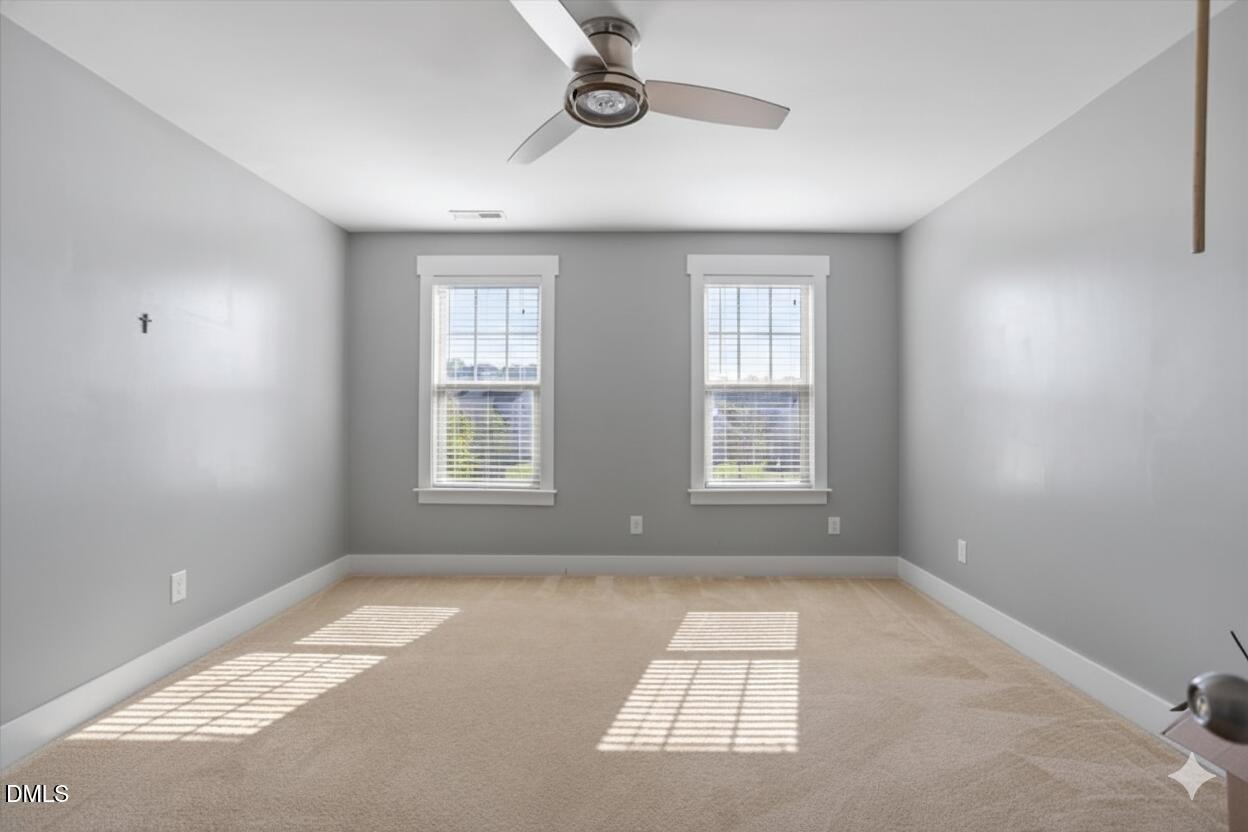 4222 Vineyard Ridge Drive Zebulon, NC 27597 - Photo 22 of 39 a view of an empty room with windows
