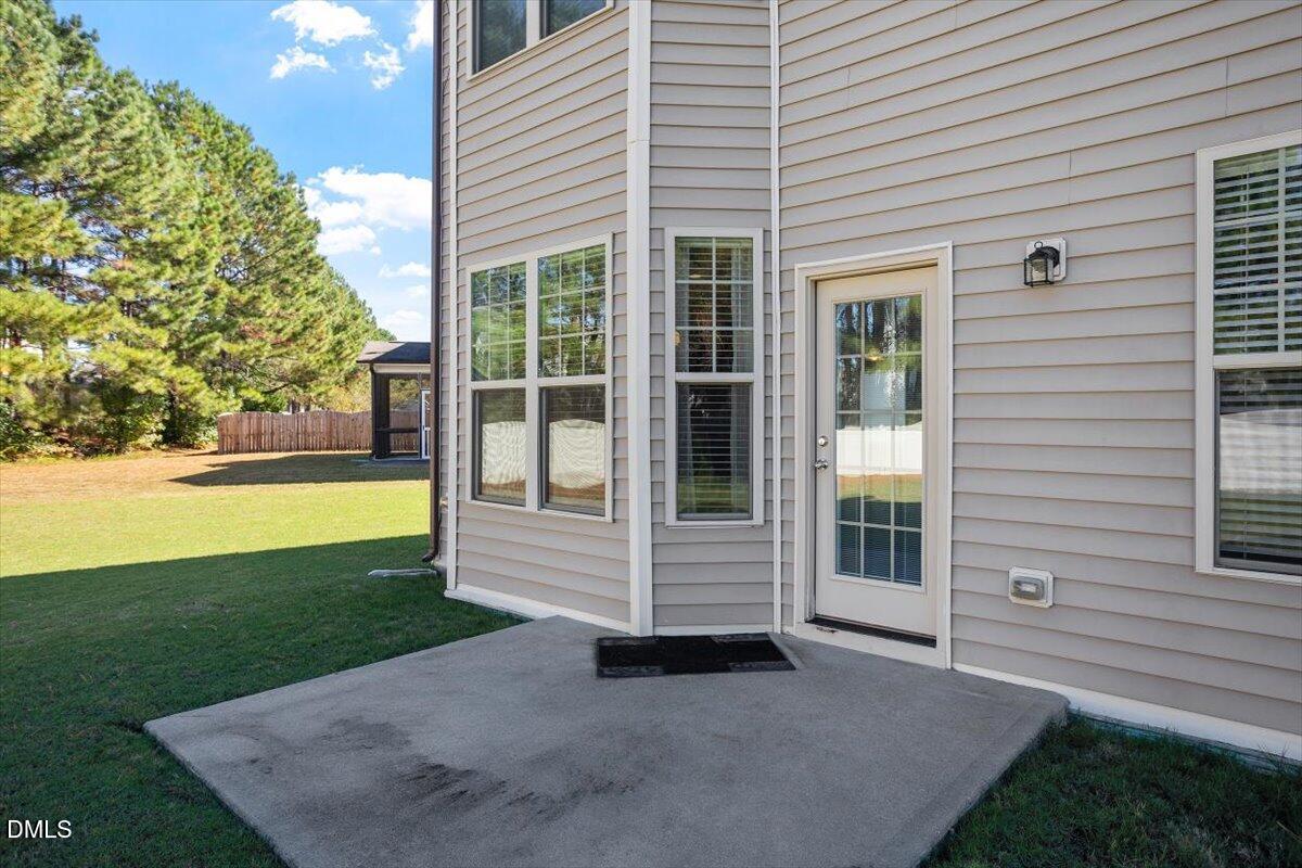 4222 Vineyard Ridge Drive Zebulon, NC 27597 - Photo 24 of 39 a view of a house with backyard