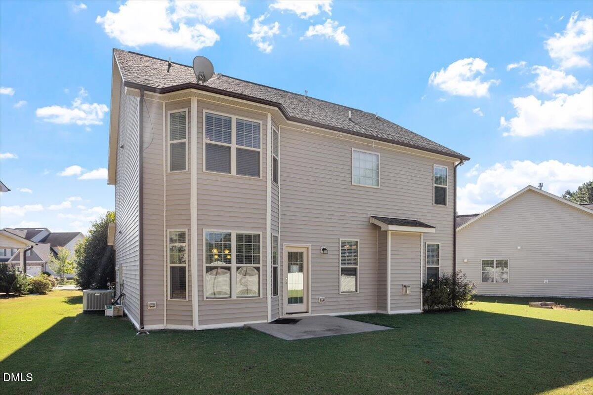 4222 Vineyard Ridge Drive Zebulon, NC 27597 - Photo 26 of 39 a view of a house with a yard
