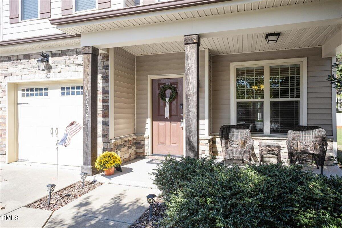 4222 Vineyard Ridge Drive Zebulon, NC 27597 - Photo 3 of 39 a front view of a building with seating space