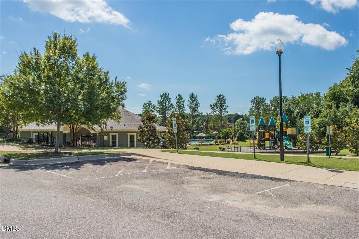 4222 Vineyard Ridge Drive Zebulon, NC 27597 - Photo 31 of 39 a view of a fountain in front of a house with a fountain