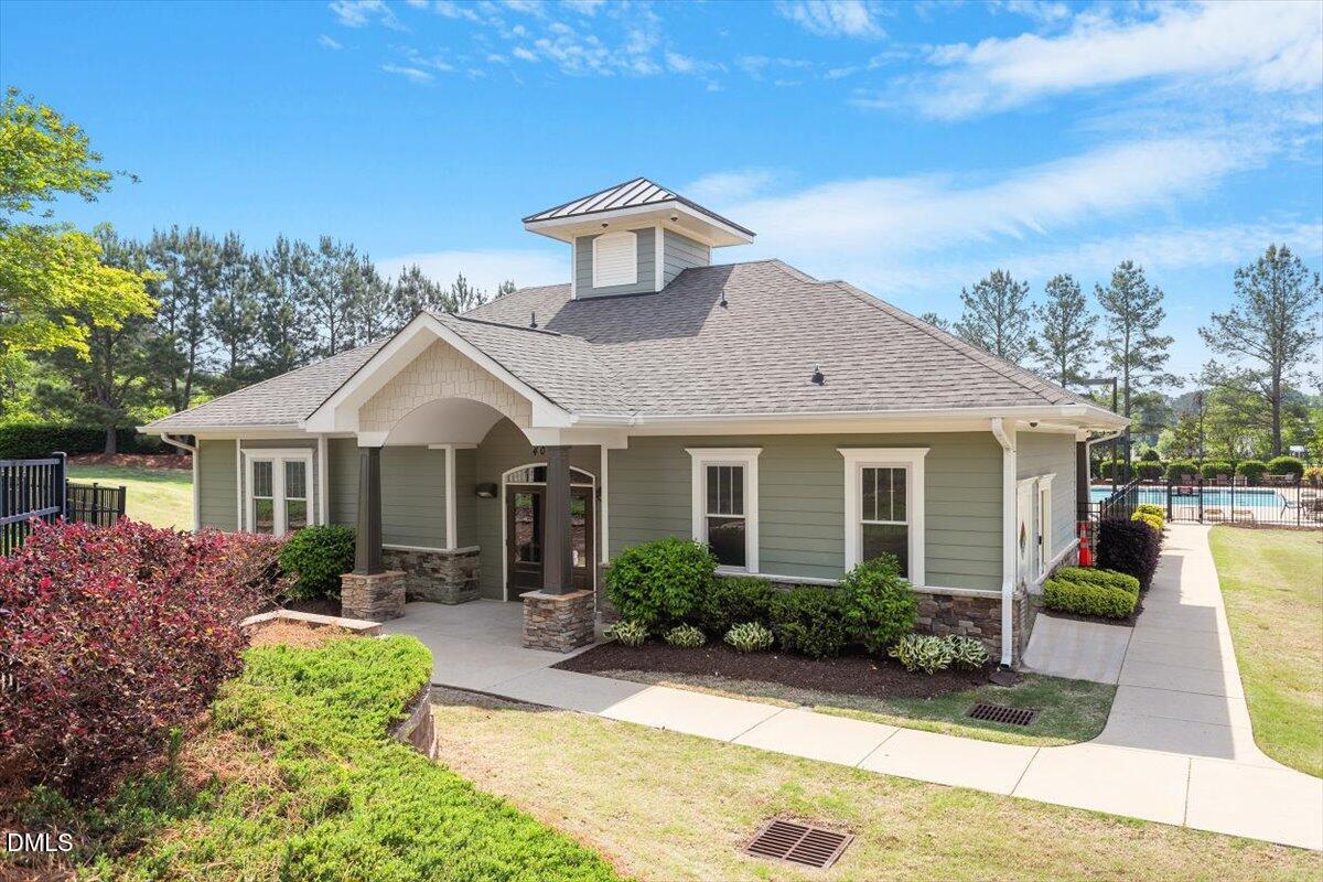 4222 Vineyard Ridge Drive Zebulon, NC 27597 - Photo 36 of 39 a front view of a house with garden