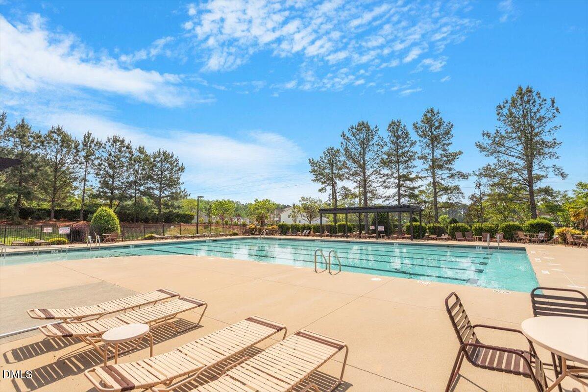 4222 Vineyard Ridge Drive Zebulon, NC 27597 - Photo 37 of 39 a view of a lake with houses in the background
