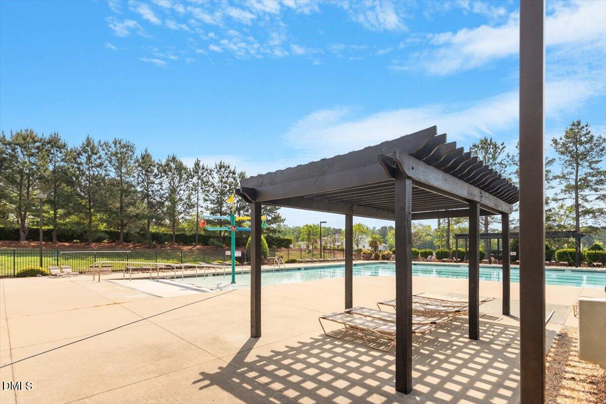 4222 Vineyard Ridge Drive Zebulon, NC 27597 - Photo 38 of 39 a view of swimming pool from a balcony