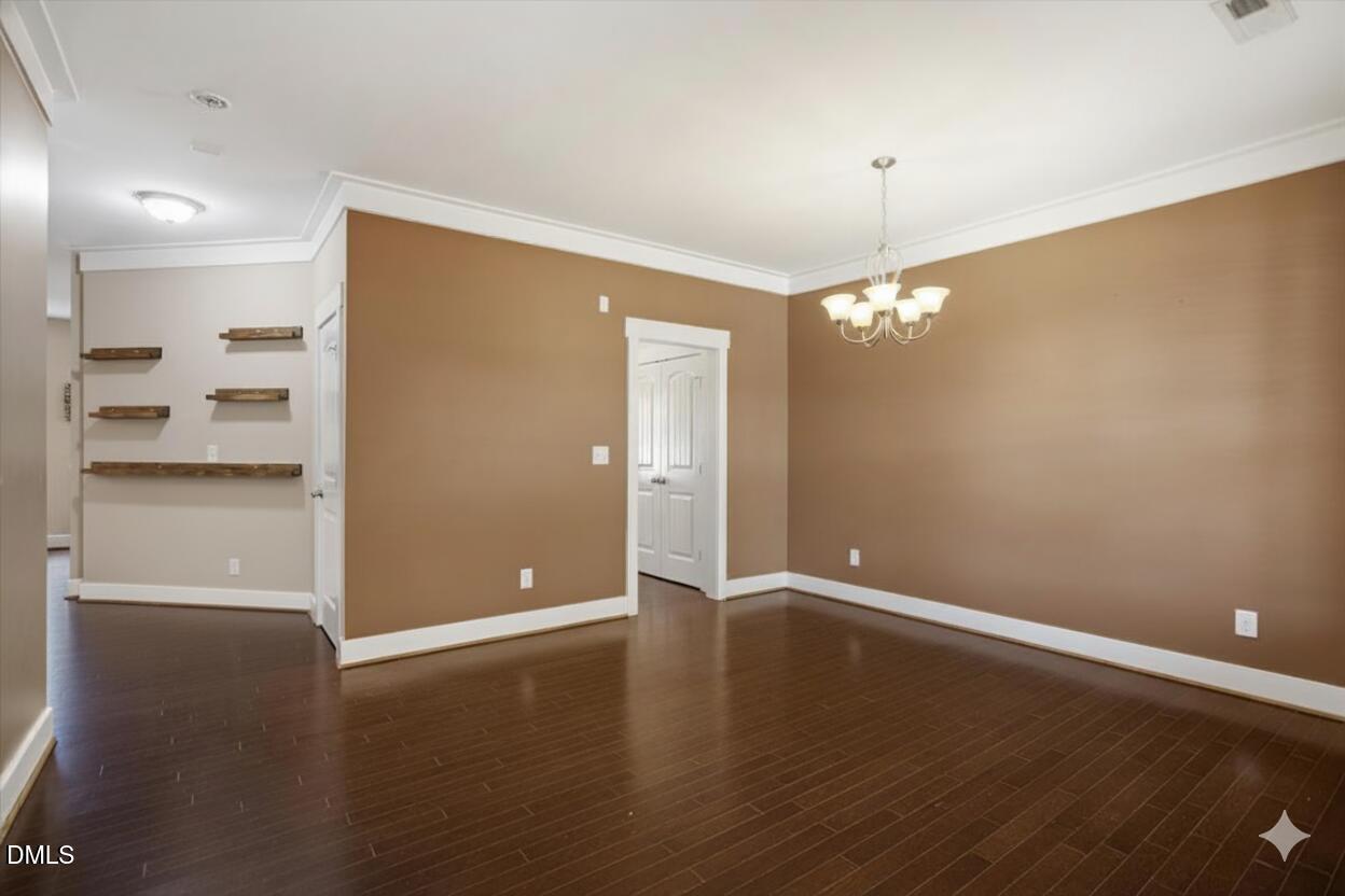 4222 Vineyard Ridge Drive Zebulon, NC 27597 - Photo 5 of 39 a view of an empty room with window and wooden floor