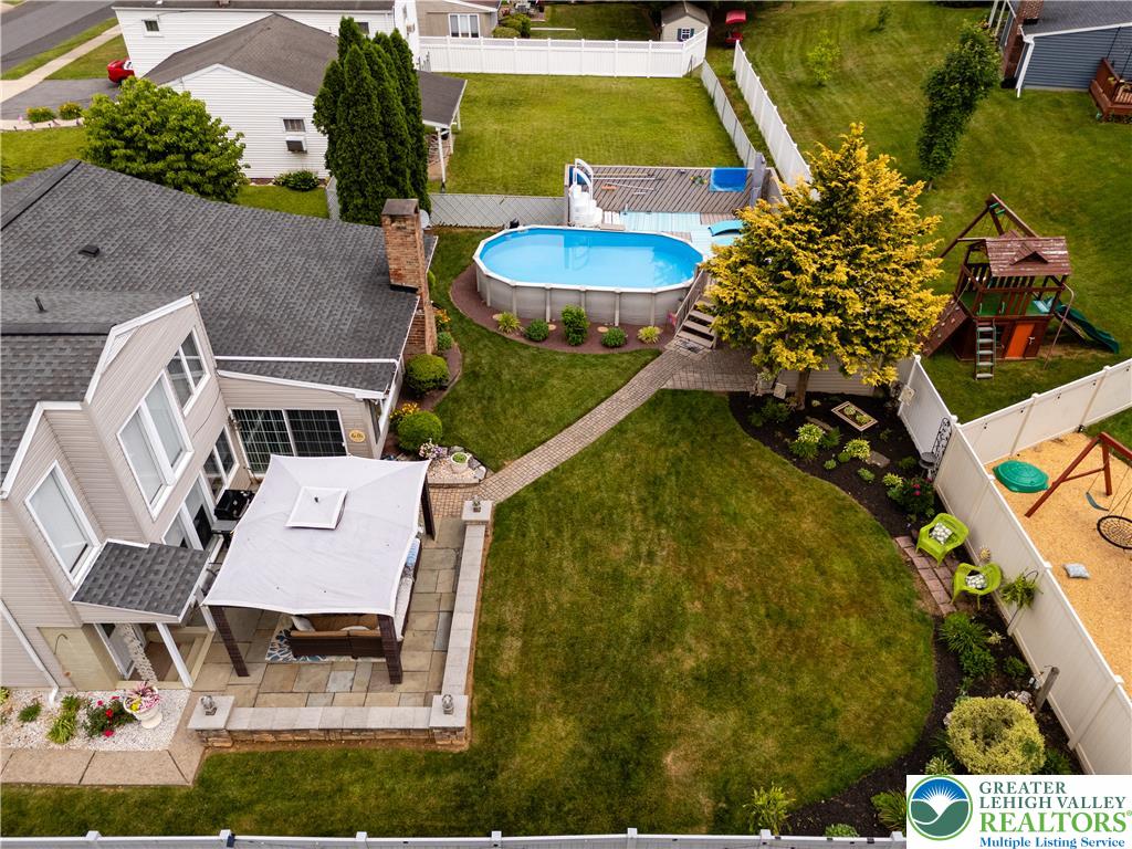 2087 Hopewell Road Bethlehem, PA 18017 - Photo 35 of 38 An inviting backyard oasis offers a sparkling pool and recreational space, all privately fenced.