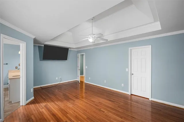 wooden floor in an empty room with a fireplace