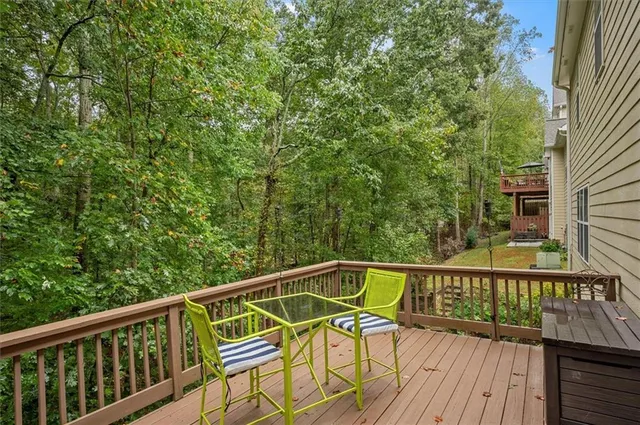 a view of a wooden deck with chairs