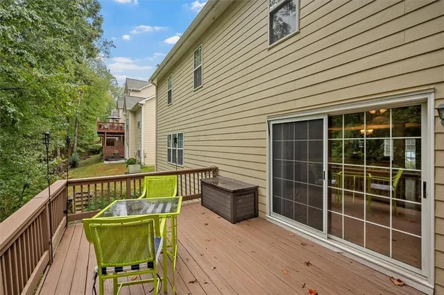 a view of a deck with wooden floor and furniture