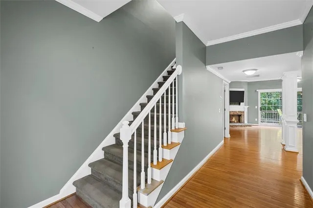 a view of an entryway with wooden floor