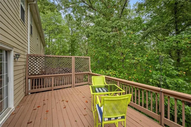 a view of balcony with wooden floor and outdoor seating