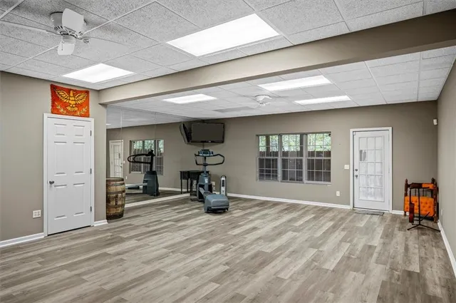 a view of a room with gym equipment and a window