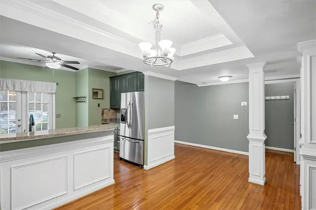 a open kitchen with stainless steel appliances granite countertop a refrigerator and a sink