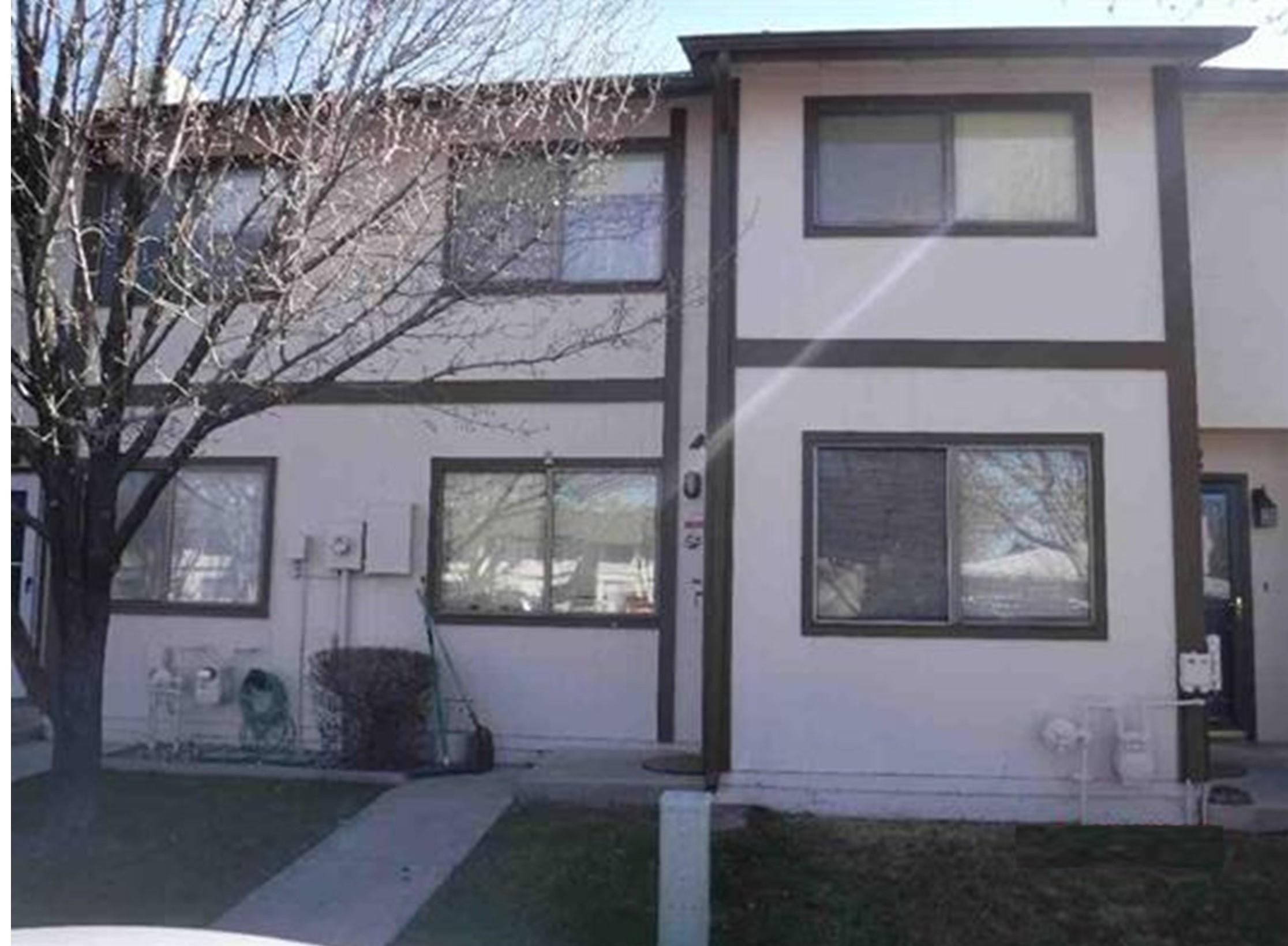 555-28 28 1/2 Road, Unit 11 Grand Junction, CO 81501 - Photo 2 of 12 a living room with furniture and a fireplace