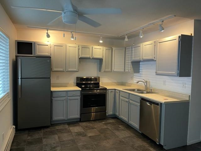 555-28 28 1/2 Road, Unit 11 Grand Junction, CO 81501 - Photo 4 of 12 a kitchen with stainless steel appliances granite countertop a refrigerator a sink and a stove
