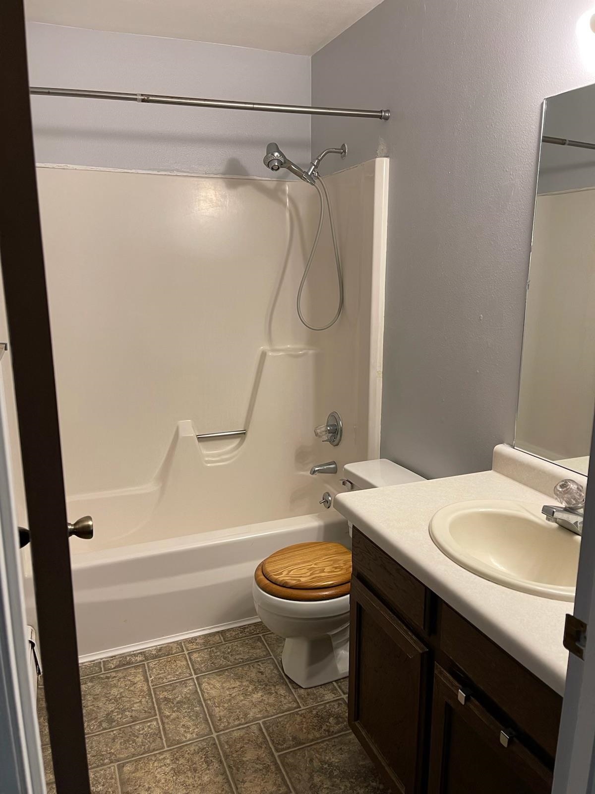 555-28 28 1/2 Road, Unit 11 Grand Junction, CO 81501 - Photo 7 of 12 a bathroom with a granite countertop sink toilet and shower