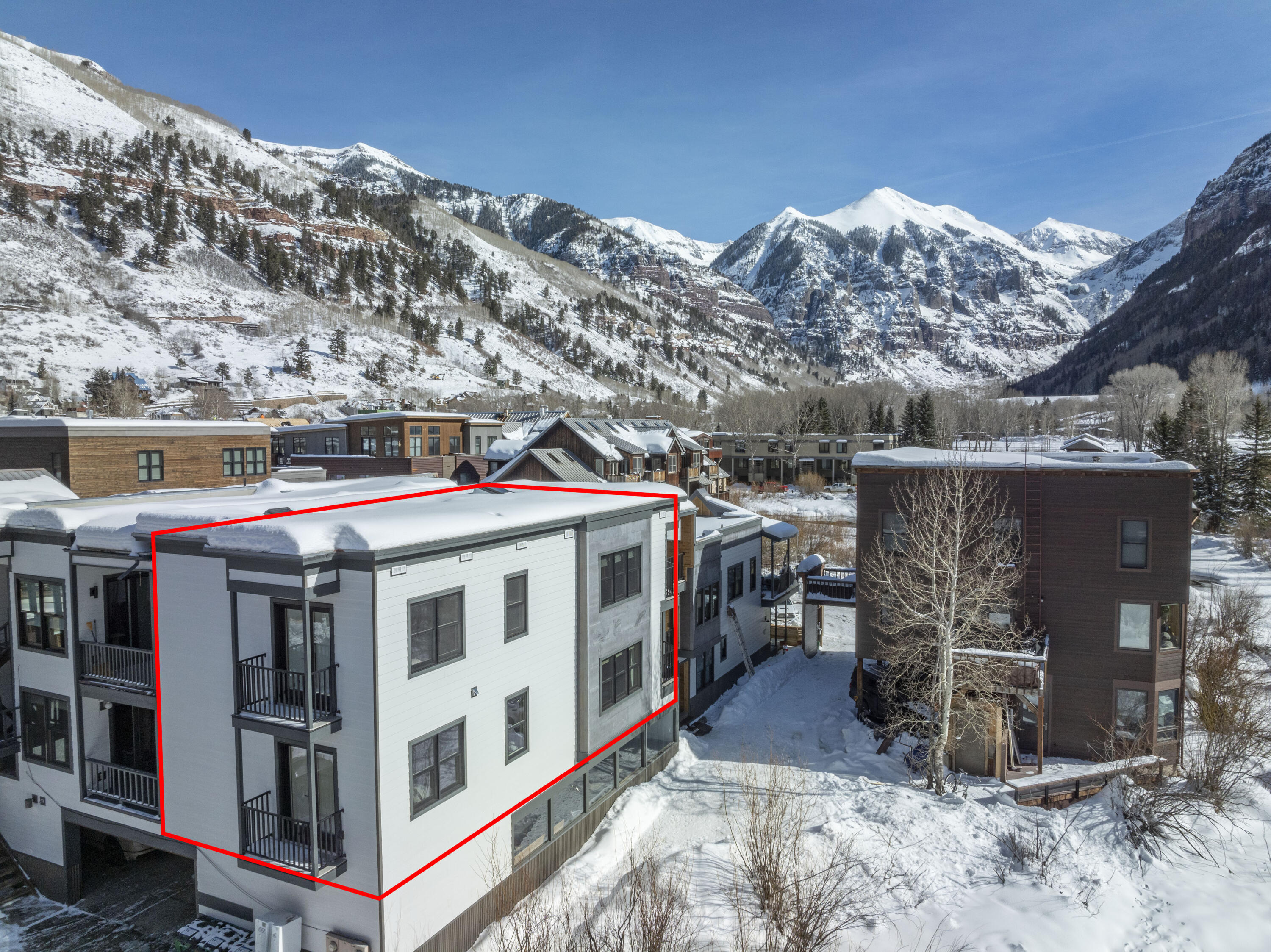 a view of a white building with a large windows