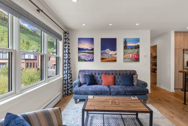 a living room with furniture and a rug