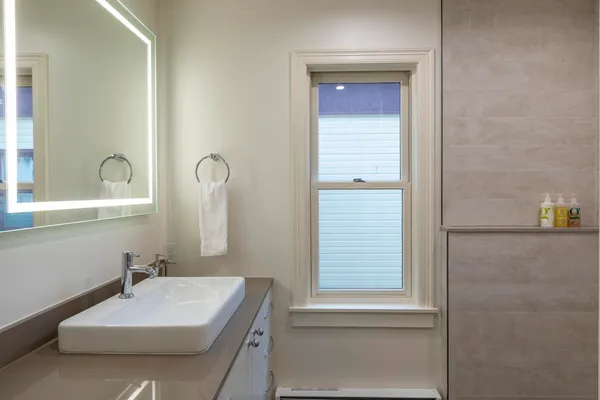 a bathroom with a sink and a mirror