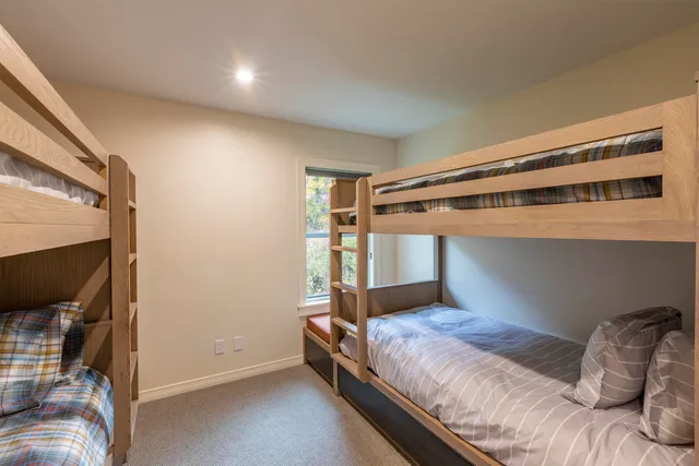 a bedroom with a bed and a mirror