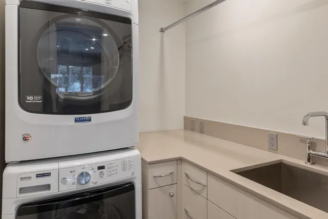 a kitchen with a stove and a sink