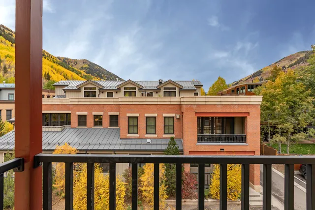 a view of houses with a swimming pool