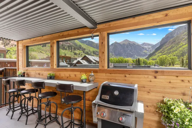 a room with furniture and a floor to ceiling window