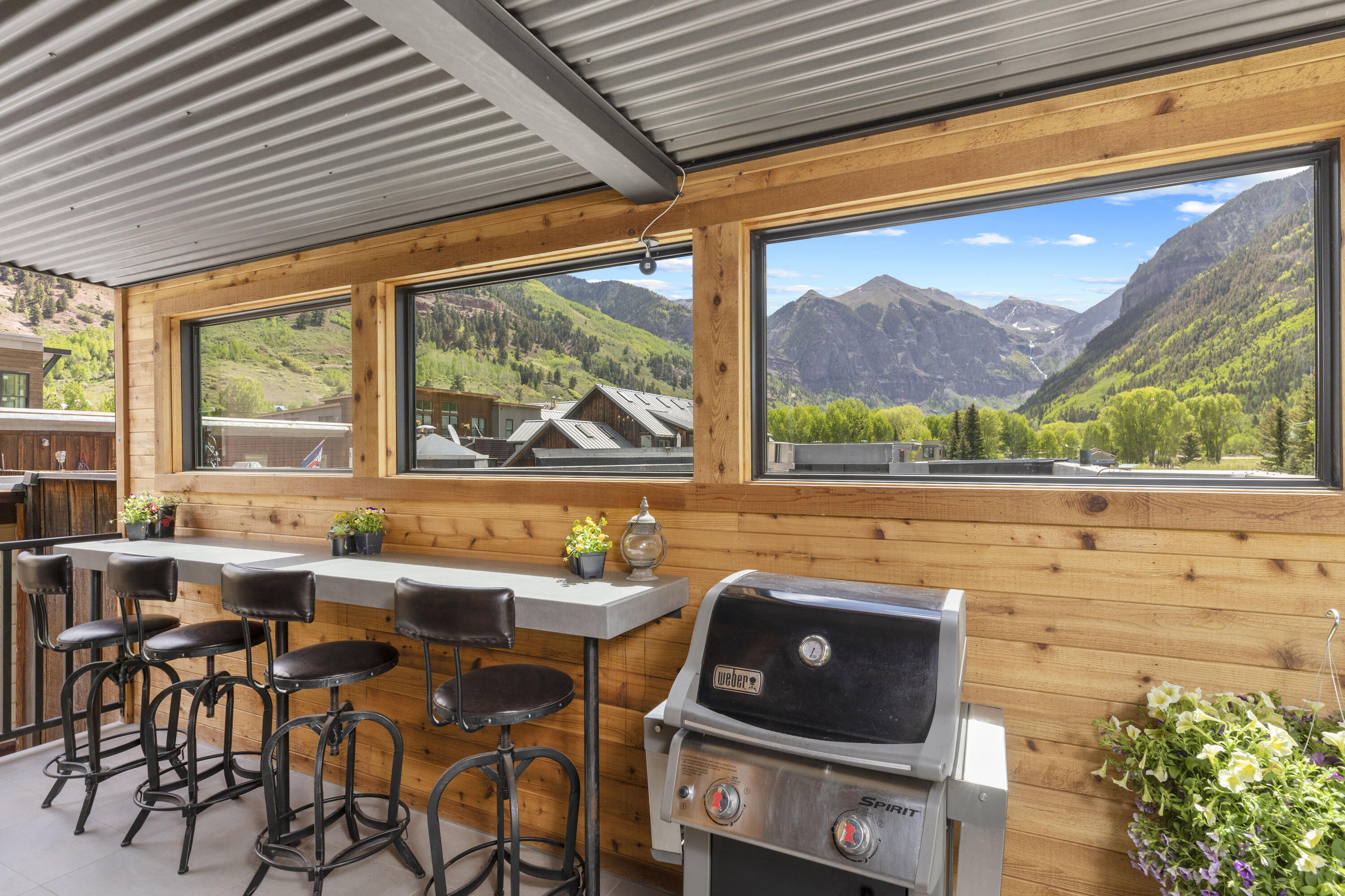 259 South Spruce Street, Unit BC Telluride, CO 81435 - Photo 26 of 28 a room with furniture and a floor to ceiling window
