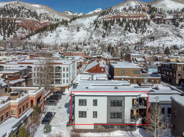 a view of a building with lots of trees