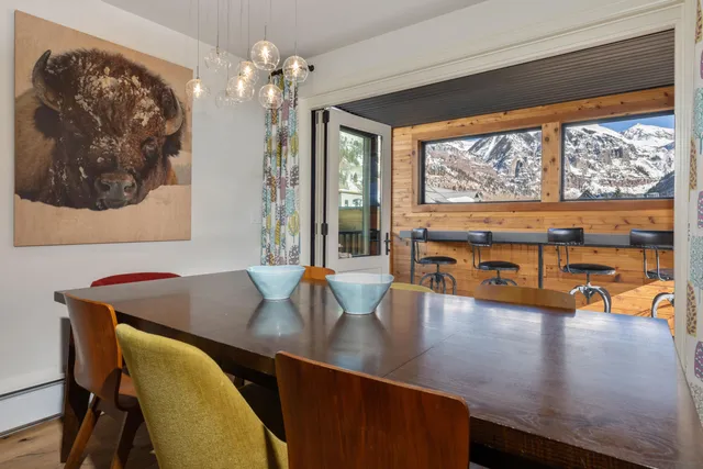 a view of a dining room with furniture window and outside view