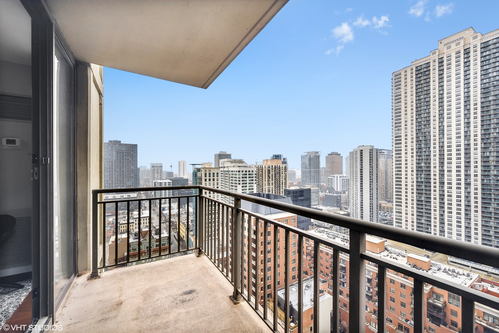 630 North State Street, Unit 2401 Chicago, IL 60654 - Photo 13 of 14 a view of city from a balcony