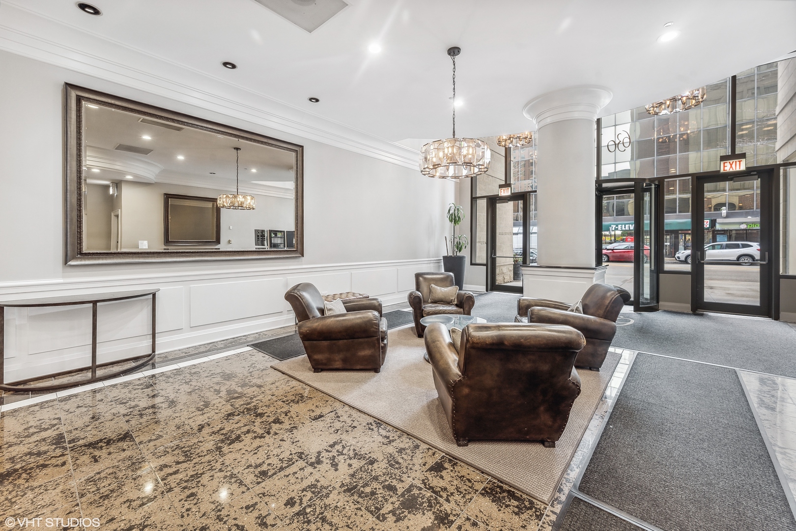 630 North State Street, Unit 2401 Chicago, IL 60654 - Photo 2 of 14 a living room with furniture and a chandelier