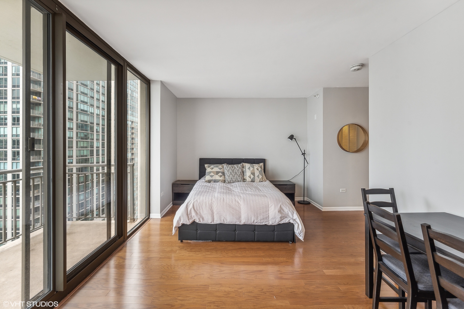 630 North State Street, Unit 2401 Chicago, IL 60654 - Photo 5 of 14 a bed sitting in a bedroom next to a window