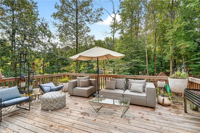a bedroom with a bed and a potted plant