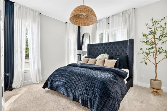 a view of entryway bedroom and hall with wooden floor