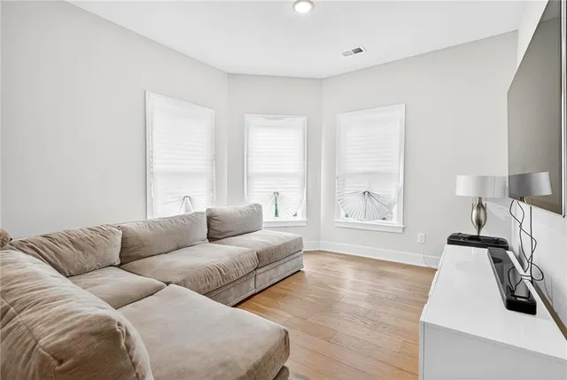 a bathroom with double vanity sinks and a mirror