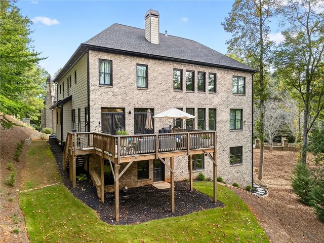an aerial view of a houses with a yard