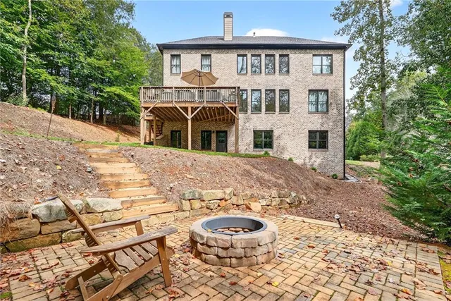 an aerial view of a residential houses with outdoor space