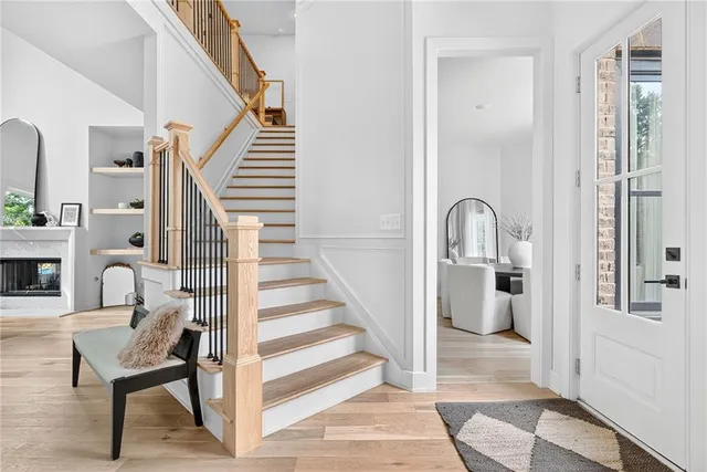 a dining room with furniture and wooden floor