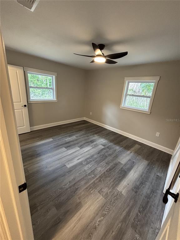 2911 Williams Road Plant City, FL 33565 - Photo 42 of 51 wooden floor in an empty room with a window
