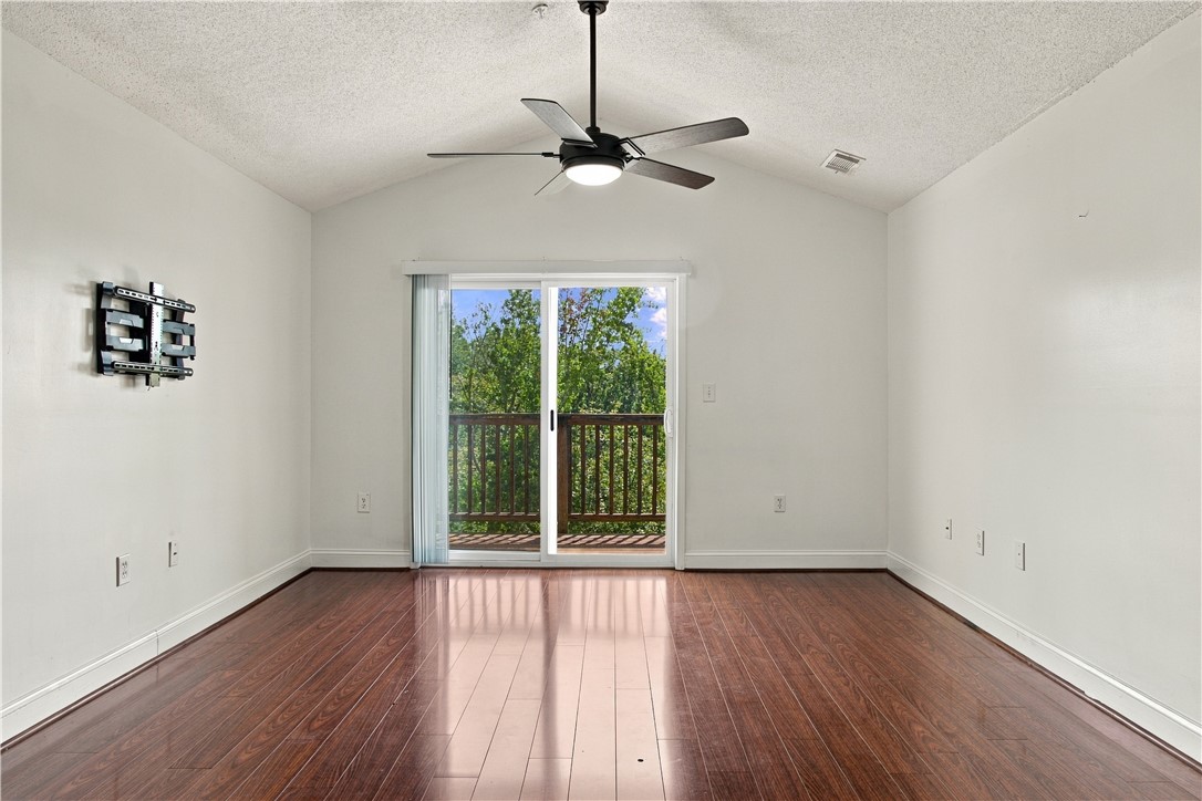 636 Lookover Drive Anderson, SC 29621 - Photo 7 of 34 Rich hardwood flooring complements the vaulted ceiling and sliding glass doors opening to the outdoors.