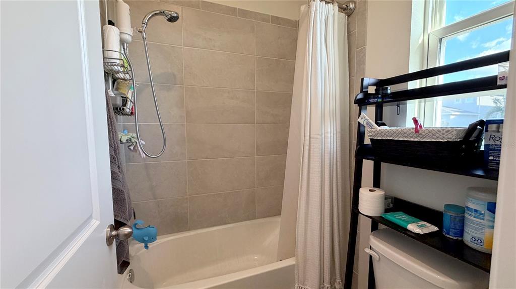 727 Annabell Rdg Road Minneola, FL 34715 - Photo 11 of 56 a bathroom with a bathtub