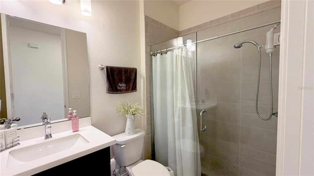 727 Annabell Rdg Road Minneola, FL 34715 - Photo 17 of 56 a bathroom with a sink toilet and shower