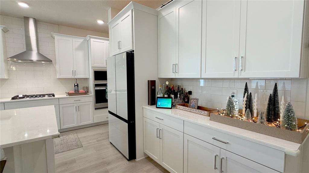 727 Annabell Rdg Road Minneola, FL 34715 - Photo 20 of 56 a kitchen with refrigerator and cabinets