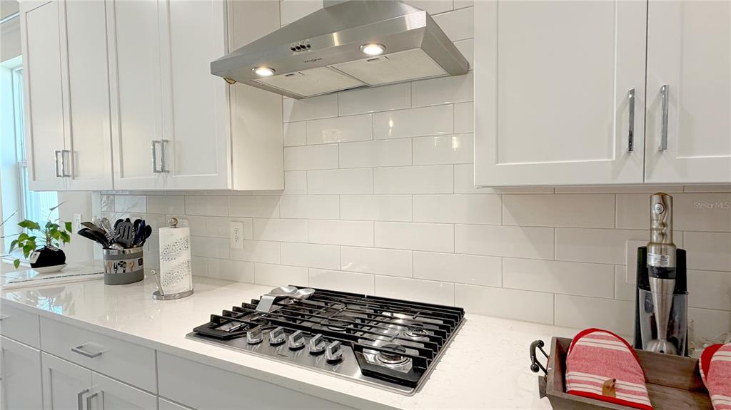 727 Annabell Rdg Road Minneola, FL 34715 - Photo 23 of 56 a kitchen with a sink stove and cabinets