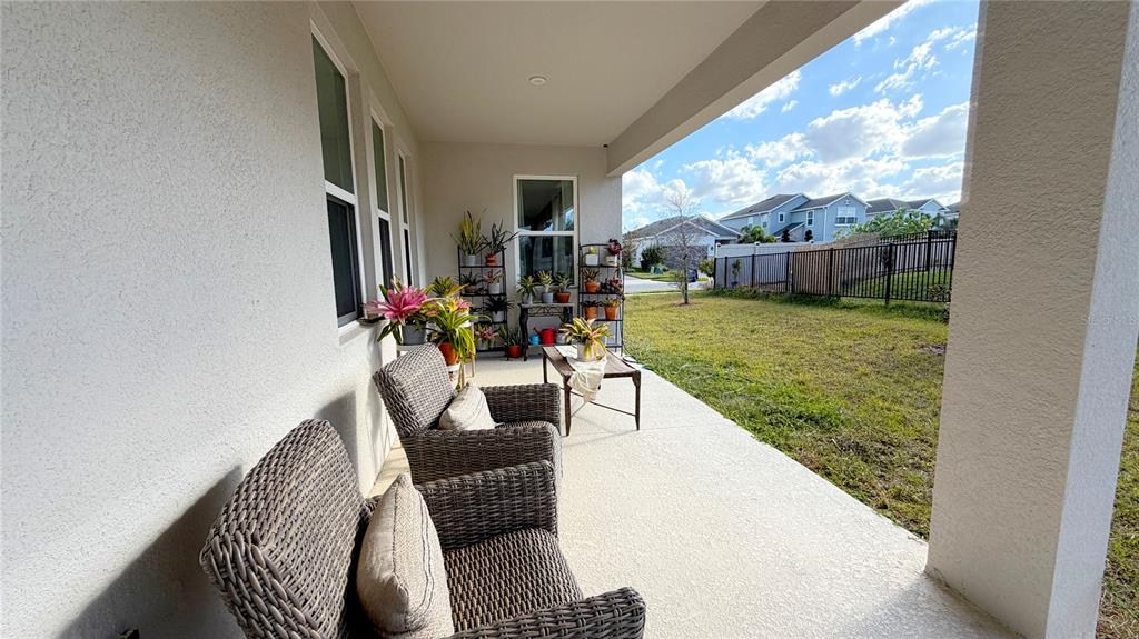 727 Annabell Rdg Road Minneola, FL 34715 - Photo 45 of 56 a dining room with furniture and a floor to ceiling window
