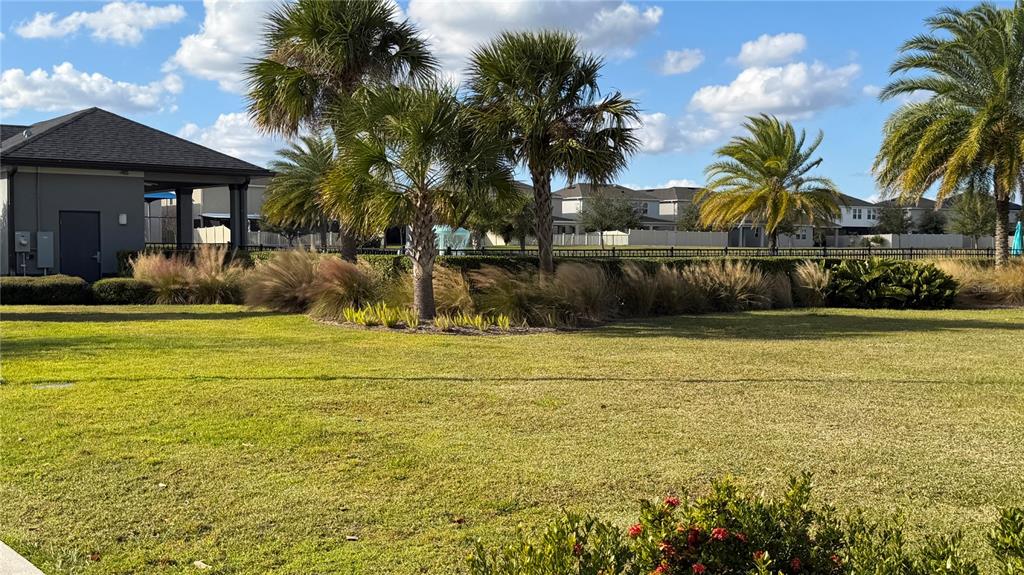 727 Annabell Rdg Road Minneola, FL 34715 - Photo 53 of 56 a front view of house with yard and lake